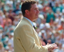 Dan Marino with his bust after his induction into the Pro Football